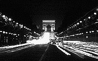 Paris black and white photos at night - Champs Elyses as seen from the Place de la Concorde